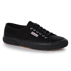 The Superga Cotu Classic Sneaker boasts a black canvas upper, matching laces, a black rubber sole, and a small fabric logo tag on the side for a simple yet classic look.