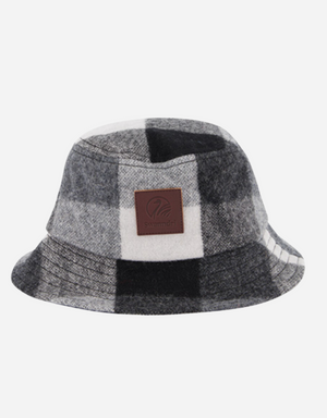 Meet the Swanndri Kaimai Wool Bucket Hat: featuring a gray and black checkered pattern and a brown logo patch. Made from soft Merino fabric, it offers a casual yet stylish look, perfect for relaxed outings.