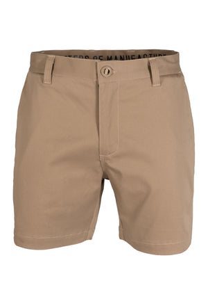 The UNIT Trench Stretch Work Short in beige features UPF 50+, reinforced button, belt loops, zip front, and side pockets. Displayed on a plain white background.