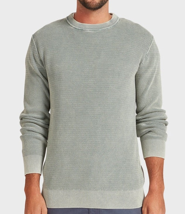 A man stands facing forward with his arms relaxed at his sides, wearing the Academy Brand Newport Crew Knit in light gray textured fabric, against a plain white background.