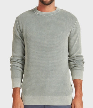 A man stands facing forward with his arms relaxed at his sides, wearing the Academy Brand Newport Crew Knit in light gray textured fabric, against a plain white background.