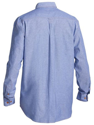 Back view of the Bisley Chambray Cotton Shirt in light blue with brown cuff buttons, a straight back yoke, center box pleat, and classic collar. Traditional Fit.