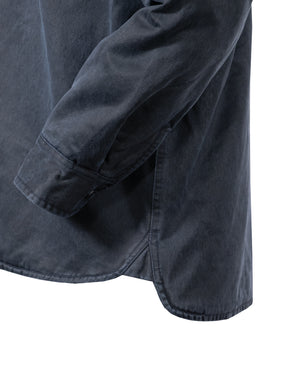 Close-up of the Outback Loxton Jacket in a dark color, highlighting the side seam and sleeve cuff. The soft fabric shows a slight hem curve, with visible stitching along the edges, resembling precise jacket craftsmanship.