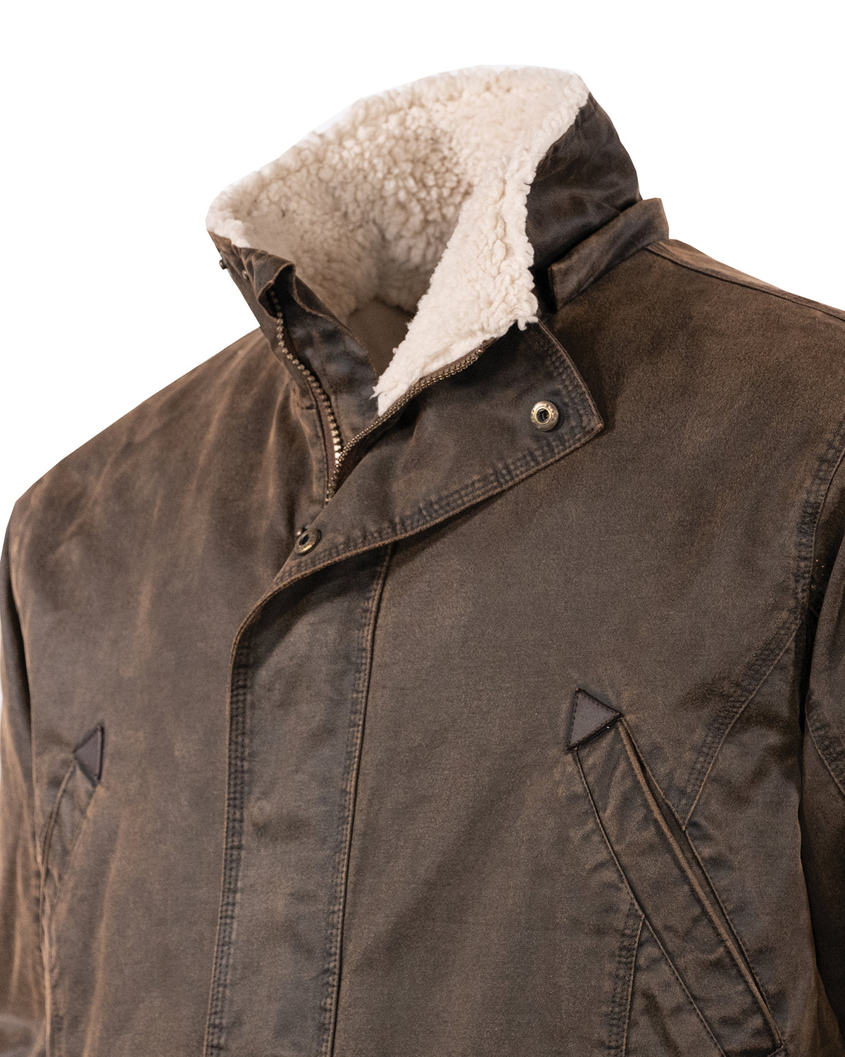 Close-up view of the Outback Nolan Jacket in brown, showcasing its rugged design with a diagonal zipper and snap-button closures. The collar and inner lining are made of plush, cream-colored sherpa material, enhancing its comfort. The jacket also features angled side pockets with flap covers.