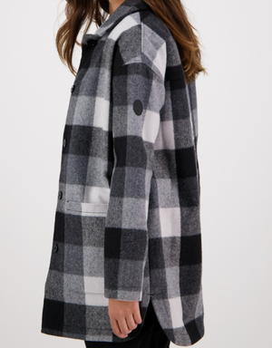 The Swanndri Becroft Wool Coat offers timeless elegance with its stylish, comfortable black, white, and gray checkered pattern. This mid-length coat features long sleeves and button closures against a clean white backdrop.