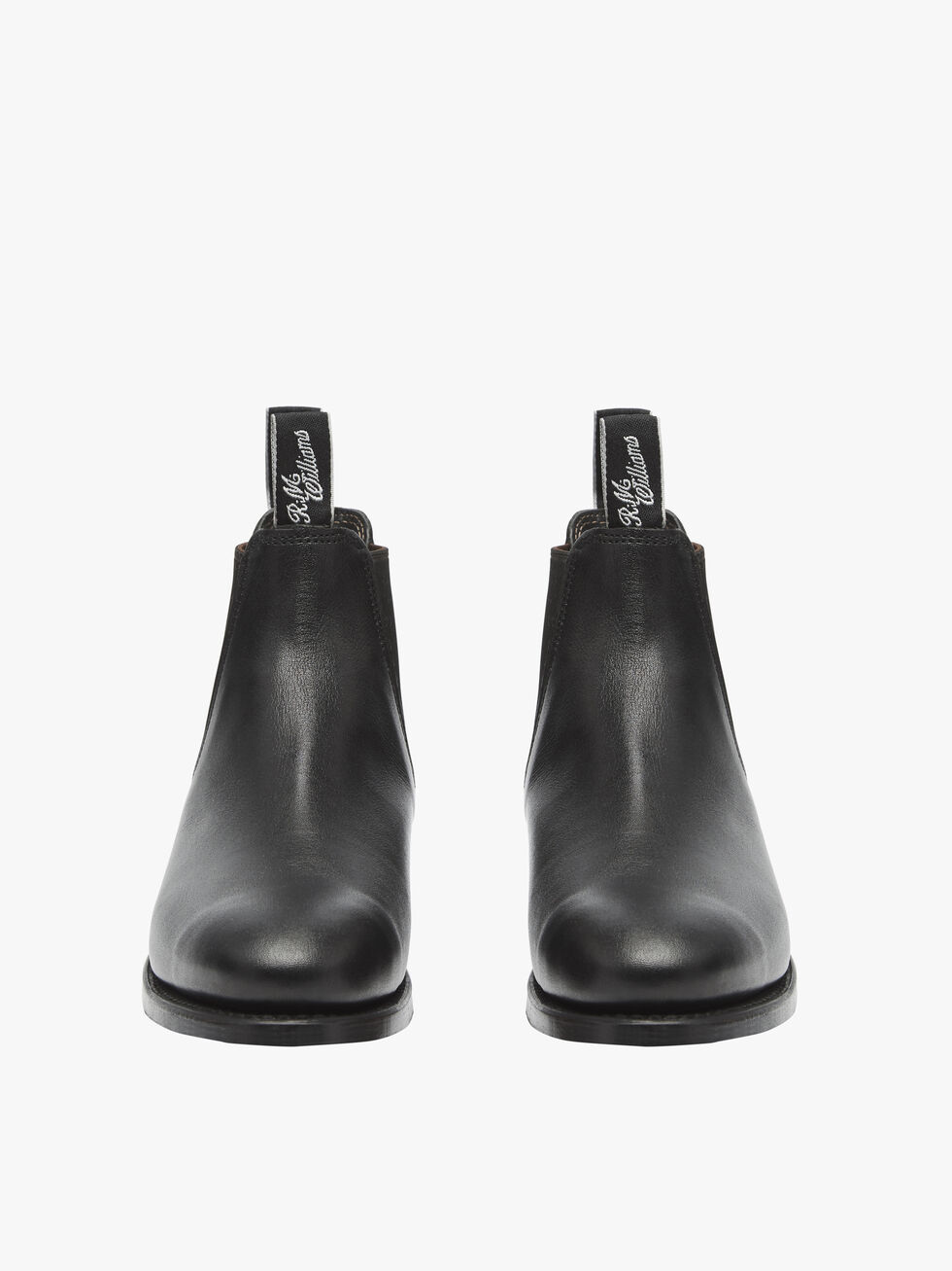The RM Williams Adelaide Kangaroo Boot in black, seen from the front, features pull tabs with white script text atop each boot, offering a smart-casual look.