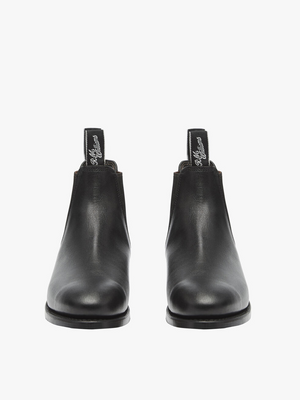 The RM Williams Adelaide Kangaroo Boot in black, seen from the front, features pull tabs with white script text atop each boot, offering a smart-casual look.