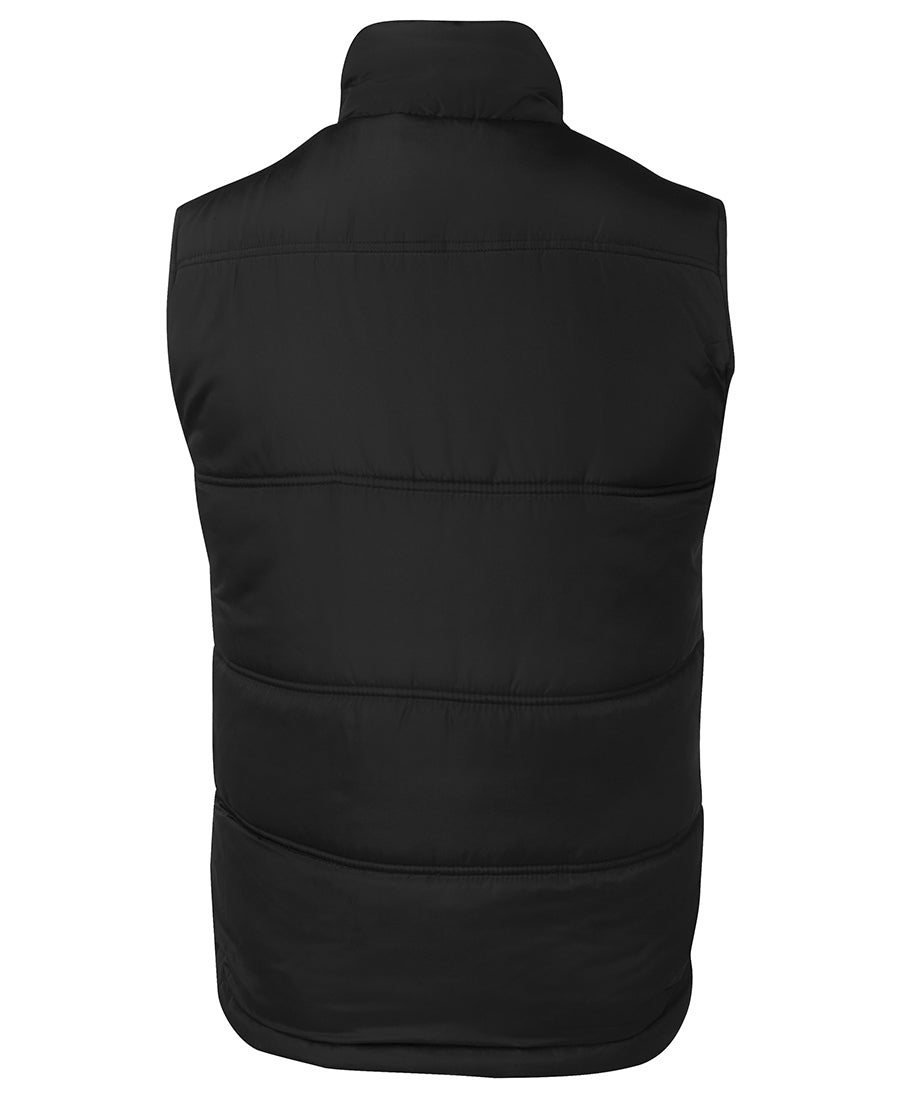 The image shows the back view of the JBs Adventure Vest in black, featuring extra thick fill, a high collar, and horizontal stitching, displayed against a plain white background.