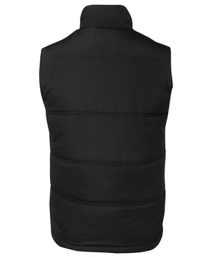 The image shows the back view of the JBs Adventure Vest in black, featuring extra thick fill, a high collar, and horizontal stitching, displayed against a plain white background.