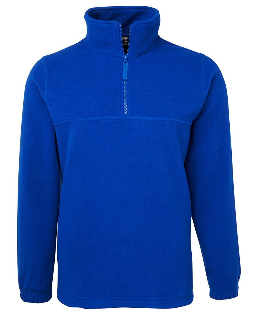 The JBs 1/2 Zip Polar Fleece is a bright blue, unisex jumper with a standing collar, half zip front, long sleeves with elastic cuffs, and a straight hem. Its simple design features no visible logos or patterns.