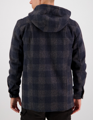 A person is shown from the back wearing the Swanndri Hudson Hoody, a dark plaid jacket made from New Zealand wool in a dark blue and gray checkered pattern, paired with black pants against a plain white background.