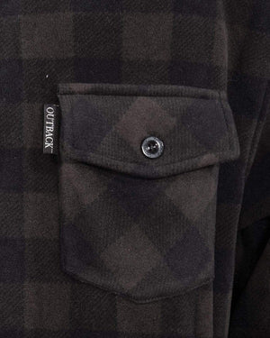 Close-up of a black and dark brown plaid fabric with a buttoned pocket, designed in mid-weight shirt style. The pocket seam has a fabric tag reading "OUTBACK" in white, adding style to the 100% polyester Outback Men's Big Shirt.