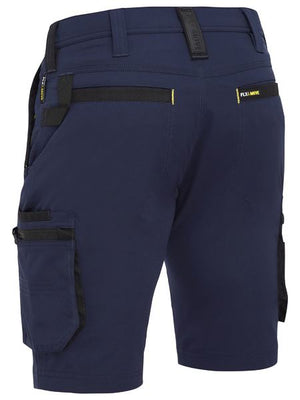 The Bisley Flex & Move 4 Way Stretch Zip Cargo Short showcases a rear view of navy blue shorts with versatile cargo pockets, black accents around the pockets and belt loops, and "FLEXMOVE" visible on the back.