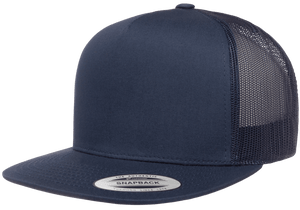 The FlexFit Classic Trucker Cap is a dark blue hat with a solid front panel and mesh back. This adjustable snap-back cap features a curved brim with a sticker attached to the front.