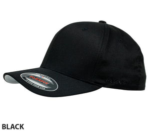 The FlexFit Worn By The World Cap is a stylish and comfortable black baseball cap with a slightly curved brim. It features a sticker on the brim displaying the Flexfit logo and product information, and the word "BLACK" is written at the bottom left corner of the image.