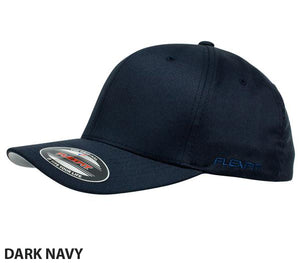 A stylish and comfortable dark navy FlexFit Worn By The World Cap with a curved contrast brim. The cap features the Flexfit logo embroidered on the side and has a sticker on the brim with the Flexfit brand and "Yupoong" text. The words "DARK NAVY" are written in bold letters at the bottom left.