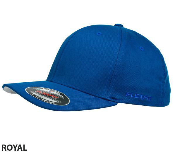 A FlexFit Worn By The World Cap in blue with a curved contrast brim, featuring no visible logos or designs except for 'FLEXFIT' embroidered on the left side. Stylish and comfortable, the cap includes a label on the brim and white text "ROYAL" beneath the image.