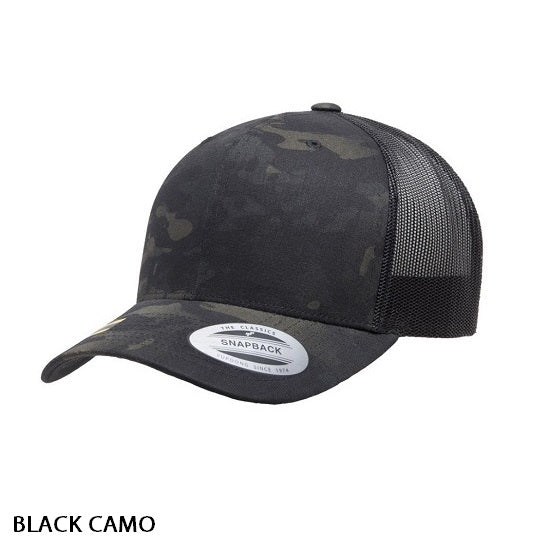 Introducing the FlexFit Retro Trucker Multicam Cap: a stylish black snapback cap featuring a curved brim and mesh back panels. This cap includes a sticker on the brim and is labeled "BLACK CAMO" in text at the bottom left of the image, embodying that classic Retro Trucker Cap aesthetic.