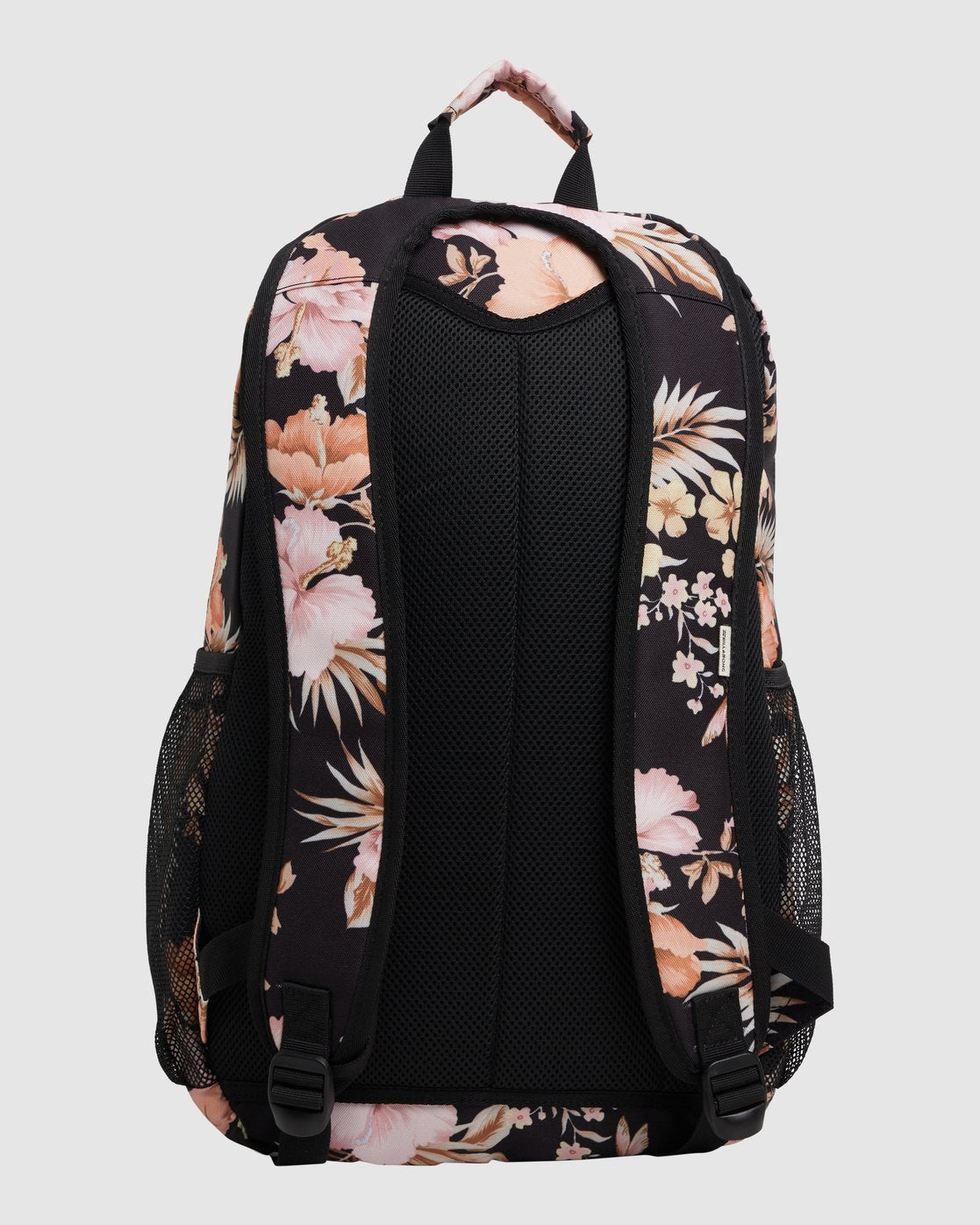 The Billabong Shallows Shaka Backpack is a black laptop bag with padded adjustable straps, pink floral print, mesh back panel and side pockets, plus a top handle covered in the floral pattern.