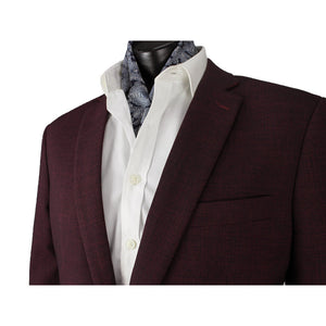 Close-up of a person wearing the Scuzzatti Sports Jacket in maroon over a white dress shirt. The shirt collar is open, revealing a patterned blue scarf tucked inside. The image focuses on the upper torso, highlighting the details of the stylish jacket and accessories.