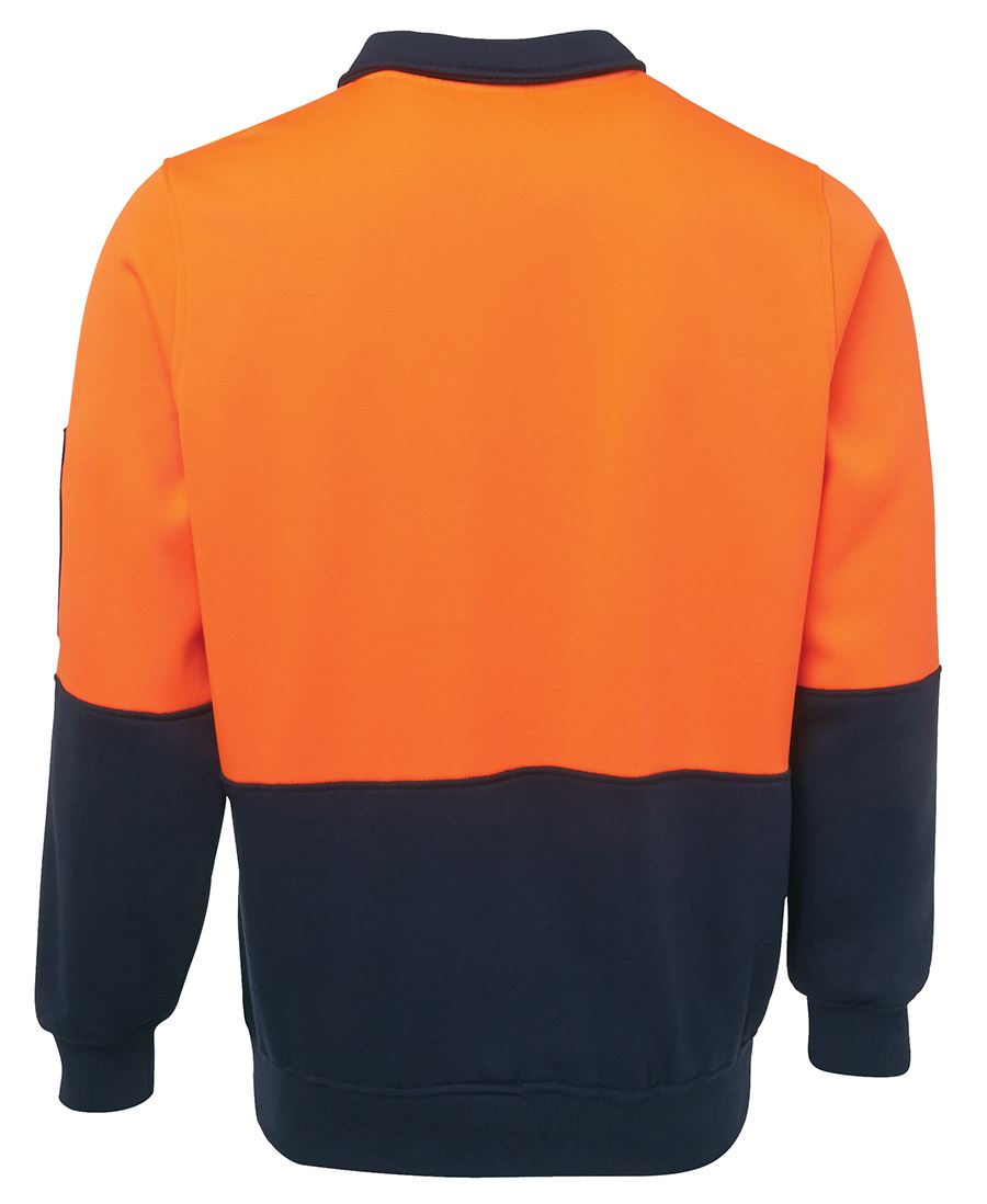 Introducing the JBs Hi Vis 1/2 Zip Fleecy, a high-visibility long-sleeve pullover. Crafted from polyester cotton, it boasts a bright orange upper part and dark blue lower part, including the cuffs and waistband. The pullover features a crew neck and includes a utility pen pocket on the left sleeve. The image displays the back view of this stylish and functional garment.