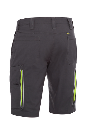Gray Bisley X Airflow Stretch Ripstop Vented Cargo Shorts viewed from the back, showcasing belt loops, pockets, and neon green zippered side pockets with reflective zip leg ventilation.