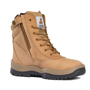 The Mongrel High Leg ZipSider Safety Boot 251050 is a tan, durable work boot featuring sturdy stitching, a reinforced steel toe cap, and a thick, slip-resistant sole for traction. It includes a lace-up closure with metal eyelets, a side zipper for easy access, and a branded patch on the ankle area displaying a horse logo and text.