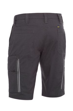 The Bisley X Airflow Stretch Ripstop Vented Cargo Shorts in dark gray are shown from the rear. Made of stretch ripstop fabric, they feature multiple pockets, horizontal ones, vertical zippers on both sides for ventilation, and belt loops for versatility.