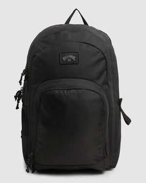 A black Billabong Command Backpack featuring multiple compartments, zippers, and a convenient top handle. It includes a padded laptop compartment for extra protection and a small Billabong logo patch on the front.