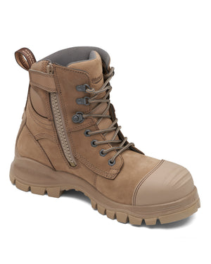 The Blundstone 984 Zip Sided Scuff Cap Safety Boot comes in a tan color and boasts a rugged sole, metal eyelets, laces, and a convenient side zipper. For added protection, it features a steel toe cap and is slip-resistant. The boot also includes a reinforced toe and a pull-on loop at the collar to ensure durability and comfort in tough working conditions.