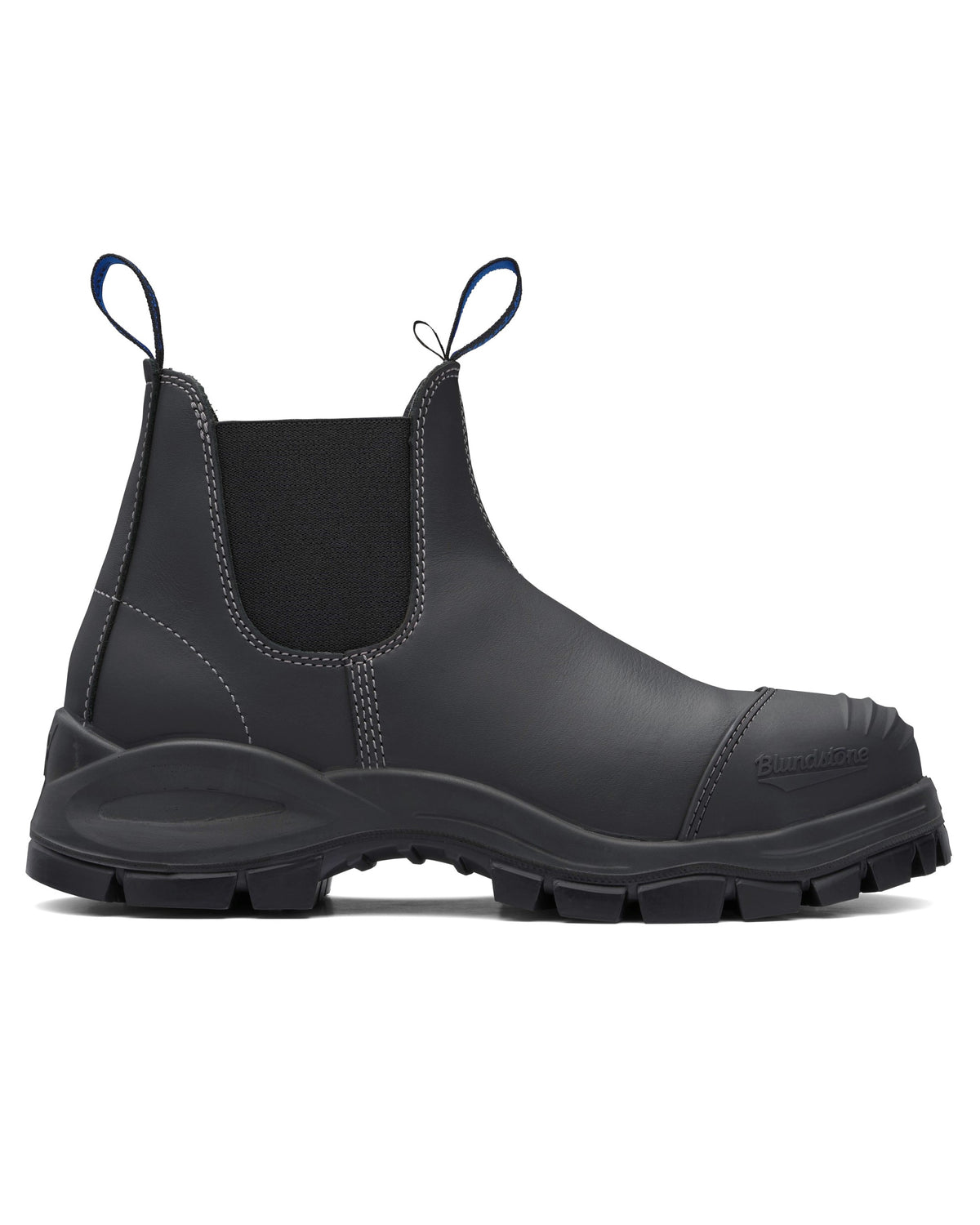 The Blundstone 990 Elastic Sided Scuff Cap Safety Boot is a black leather Chelsea boot with elastic side panels, pull tabs, and a rugged rubber sole. It features a water-resistant finish and is shown in side profile view to highlight its sleek design and durable construction.