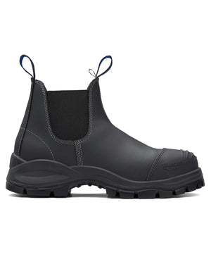 The Blundstone 990 Elastic Sided Scuff Cap Safety Boot is a black leather Chelsea boot with elastic side panels, pull tabs, and a rugged rubber sole. It features a water-resistant finish and is shown in side profile view to highlight its sleek design and durable construction.