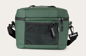 The Ringers Western Newport Soft Cooler Bag is a green camera bag featuring a black adjustable shoulder strap and carrying handle. It includes a zippered mesh pocket on the front and tags for branding. The main compartment is accessible via two zippers on the top, making this versatile bag also function as an insulated cooler. Its design is simple and structured.