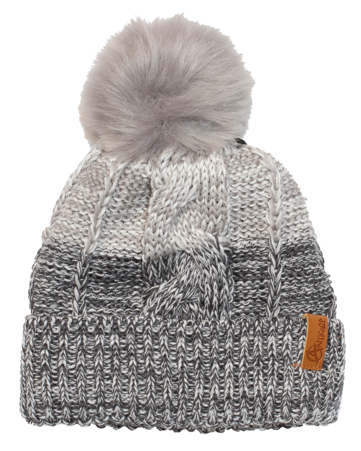 The Anticorp Ladies Freshies Beanie is a knitted winter hat featuring a large gray pom-pom on top. It boasts a stylish gradient design that transitions from light gray at the top to darker gray at the bottom. A brown leather patch is sewn onto the folded brim, and its cozy fleece lining ensures warmth.