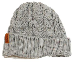 The Anticorp Ladies Twist Lined Beanie is a grey, cable-knit beanie adorned with multicolored speckles. It features a folded brim, soft fleece lining for added comfort, and a small brown leather Anticorp label on the side.