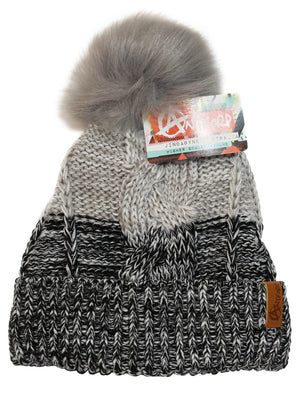 The Anticorp Ladies Freshies Beanie is a gray and black knitted hat adorned with a large, fluffy pom-pom on top. It features Anticorp branding on a label and has a small leather patch sewn onto the folded brim. Enhanced with fleece lining and boasting a textured pattern, this beanie offers a cozy, warm appearance.