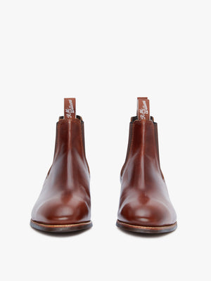 A pair of brown RM Williams Comfort Craftsman Boots in yearling leather with pull tabs, shown from the front on a white background—highlighting timeless Australian-made quality.