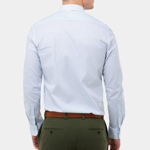 A person is seen from behind wearing a light blue, long-sleeved Brooksfield Stretch Print Shirt with a subtle dotted pattern, olive green trousers featuring two back pockets with buttons, and a brown belt. The background is plain white.
