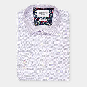 A neatly folded Brooksfield Stretch Print Shirt with a subtle purple dotted pattern displayed against a white background. The inside of the collar features a contrasting floral pattern. The label reads "Brooksfield - Non Iron - STRETCH - A9". This stylish shirt seamlessly combines comfort and elegance.