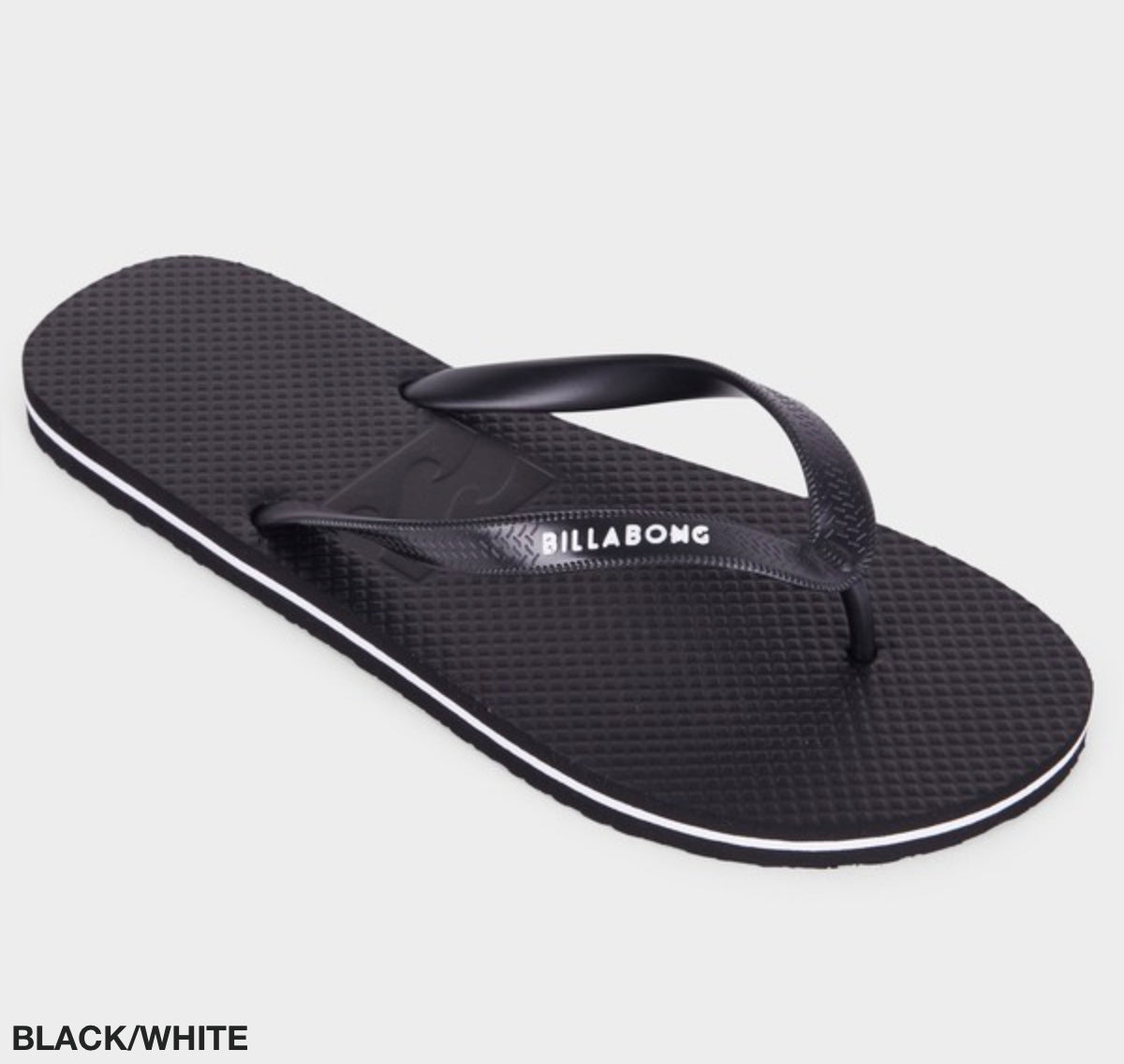 A single Billabong Lowdown Splice Thong flip-flop in black is displayed against a white background. It features a textured footbed and molded upper straps, with the Billabong brand name written in white on the right strap near the base. The image includes the text "BLACK/WHITE" in the bottom left corner.