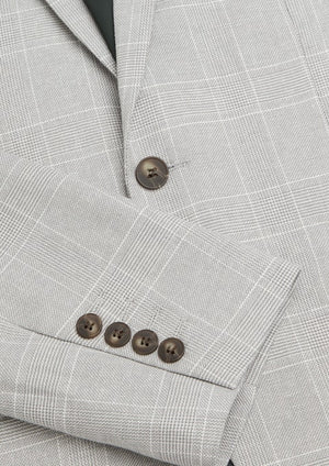 Close-up of the Connor Sorrento Slim Suit Jacket in light gray plaid with brown sleeve and front buttons, styled with the sleeve neatly folded over the body for a sharp, modern look.
