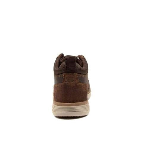 Rear view of the Colorado Yarra Casual Boot, showcasing a blend of suede and leather textures. The shoe features a white sole with a beige accent, brown laces, and a back pull-tab. Slip-resistant outsoles and memory foam insoles provide enhanced comfort, while the lighting emphasizes the variety of materials used on the upper.