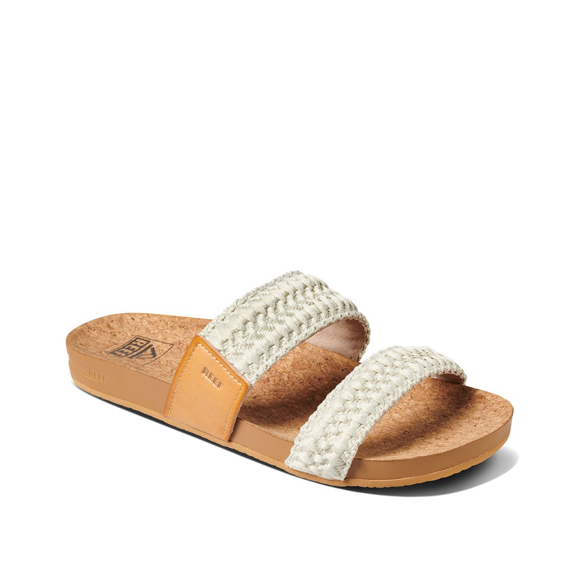 The REEF Cushion Vista Thread sandal has two braided cream straps over a tan EVA foam sole with cushion bounce technology, featuring a slight wedge and textured footbed for comfort, providing a casual, summery look.