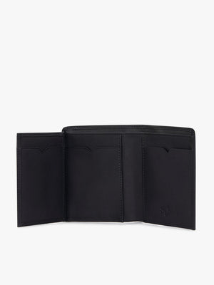 The RM Williams Urban Small Slim Tri-Fold wallet in black full grain leather is open, showing multiple card slots and compartments with the RM Williams logo, set against a white background.