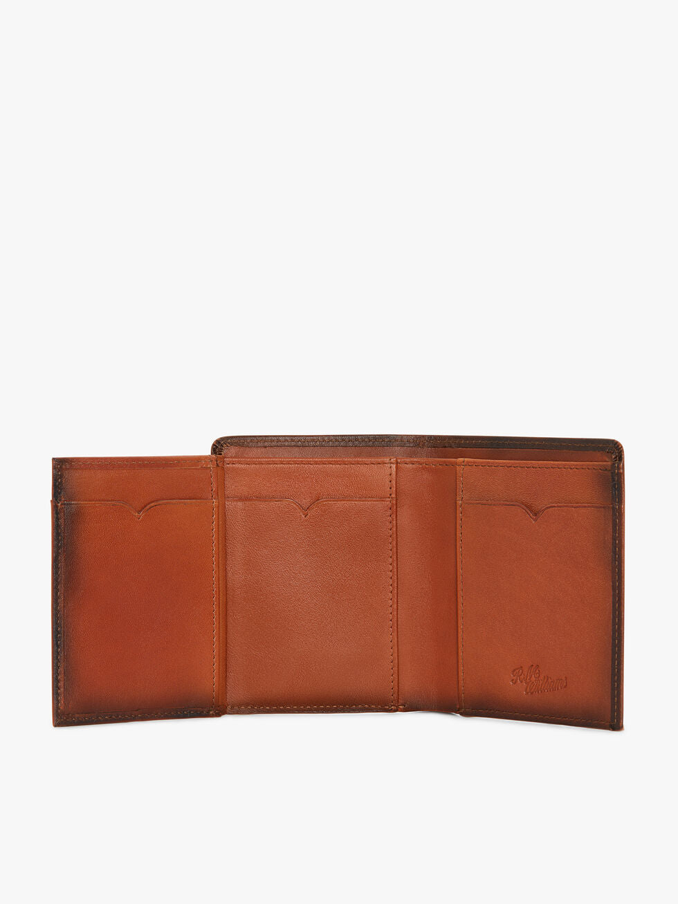 The RM Williams Urban Small Slim Tri-Fold is a brown full grain leather wallet with three card slots, subtle stitching, and an embossed logo on the right panel. Shown open, it displays its organized interior.