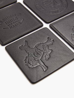 The RM Williams Heritage 6 Pack Coaster Set includes beautifully embossed black leather coasters. Some feature a cowboy on a bucking horse, while others display unique text and logos. Expertly crafted in Australia, these coasters stand out in an eye-catching grid pattern.