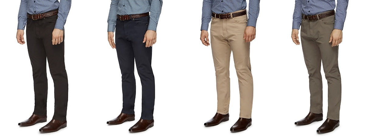 Four mannequins at City Club showcase blue patterned shirts, brown woven belts, brown dress shoes, and stylish City Club Austin Road Pants available in black, navy blue, beige, and grey.