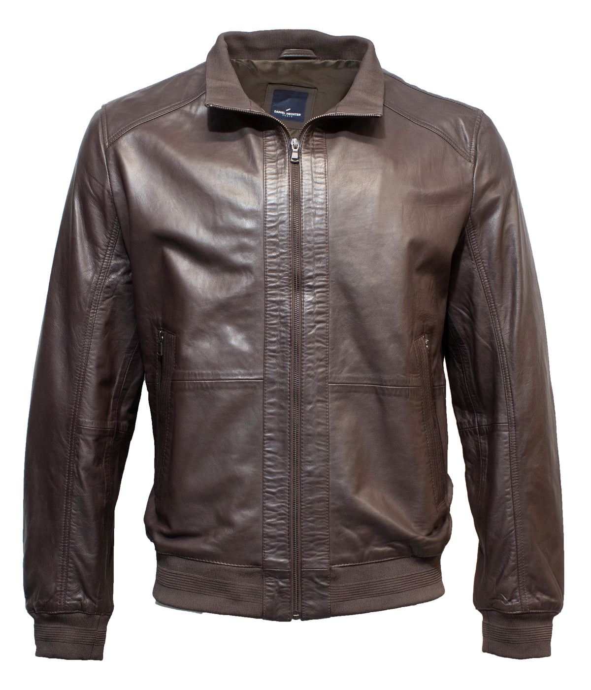 The Daniel Hechter Oscar Leather Jacket in brown features a front zipper, zippered pockets, ribbed cuffs, and waistband. With a soft sheen and slightly raised collar, this stylish jacket offers a classic look suitable for various casual and semi-formal occasions.