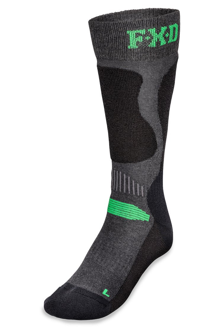 The FXD SK-7 Tech Sock 2 Pack includes a pair of gray and black athletic socks with green accents and the acronym "FMD" on the cuff. Designed for technical performance, these work socks feature an ergonomic design with various textured areas to provide support and comfort. The moisture-wicking properties ensure your feet stay dry during intense activities.