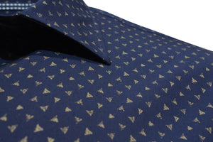 The Back Bay Bamboo Soft Touch Print Short Sleeve Shirt displays a navy blue color with small gold triangles, a neat collar, and is made from a bamboo/polyester blend for a smooth, slightly shiny fabric texture.